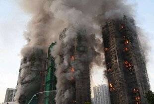 Closer 1069 151 morts dans l'incendie dévastateur de gratte-ciel à Hong Kong